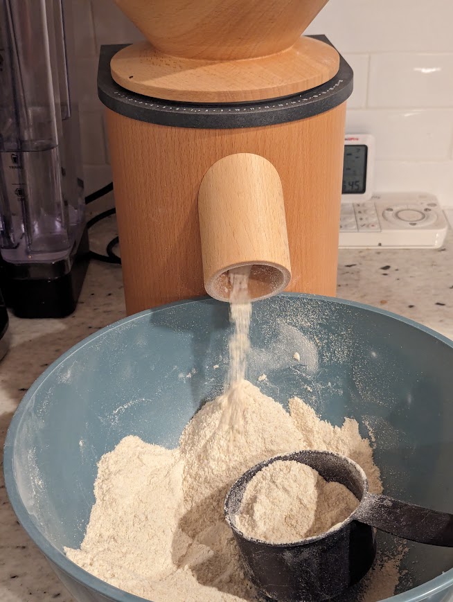 Mockmill grinding flour into a bowl