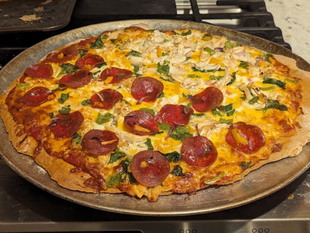 Fresh Milled Flour Pizza with veggies, half with shredded chicken and half with pepperoni