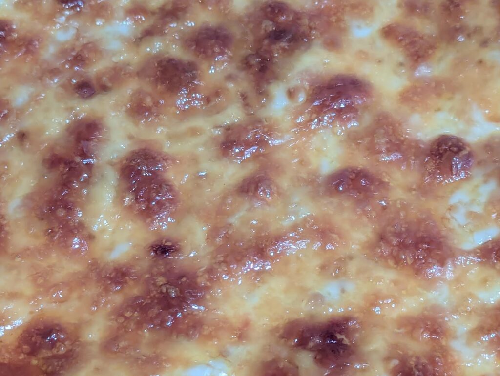 Melted cheese on fresh milled flour pizza