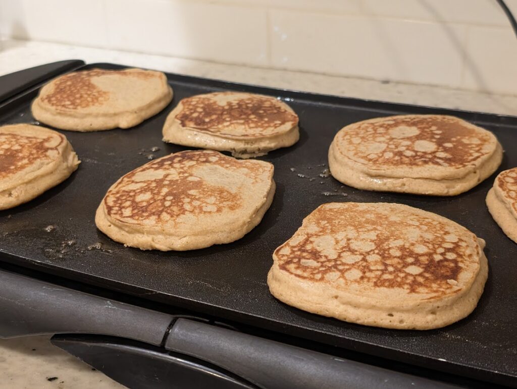 Pancakes cooking on griddle