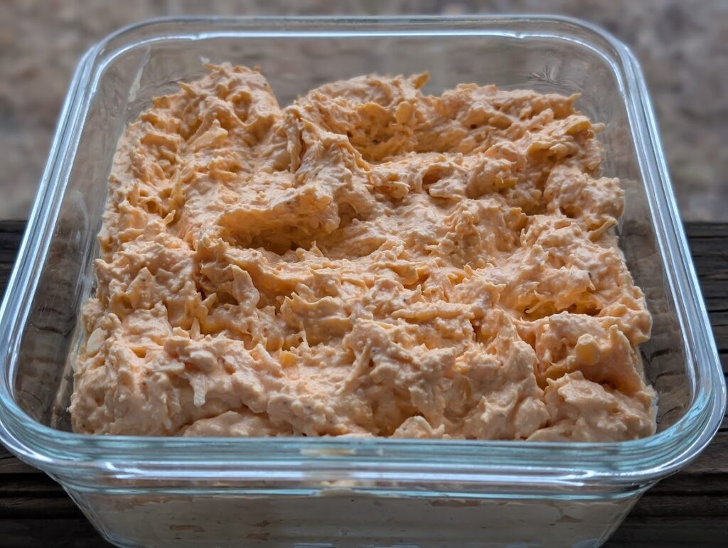 High Protein Buffalo Chicken Dip in glass dish