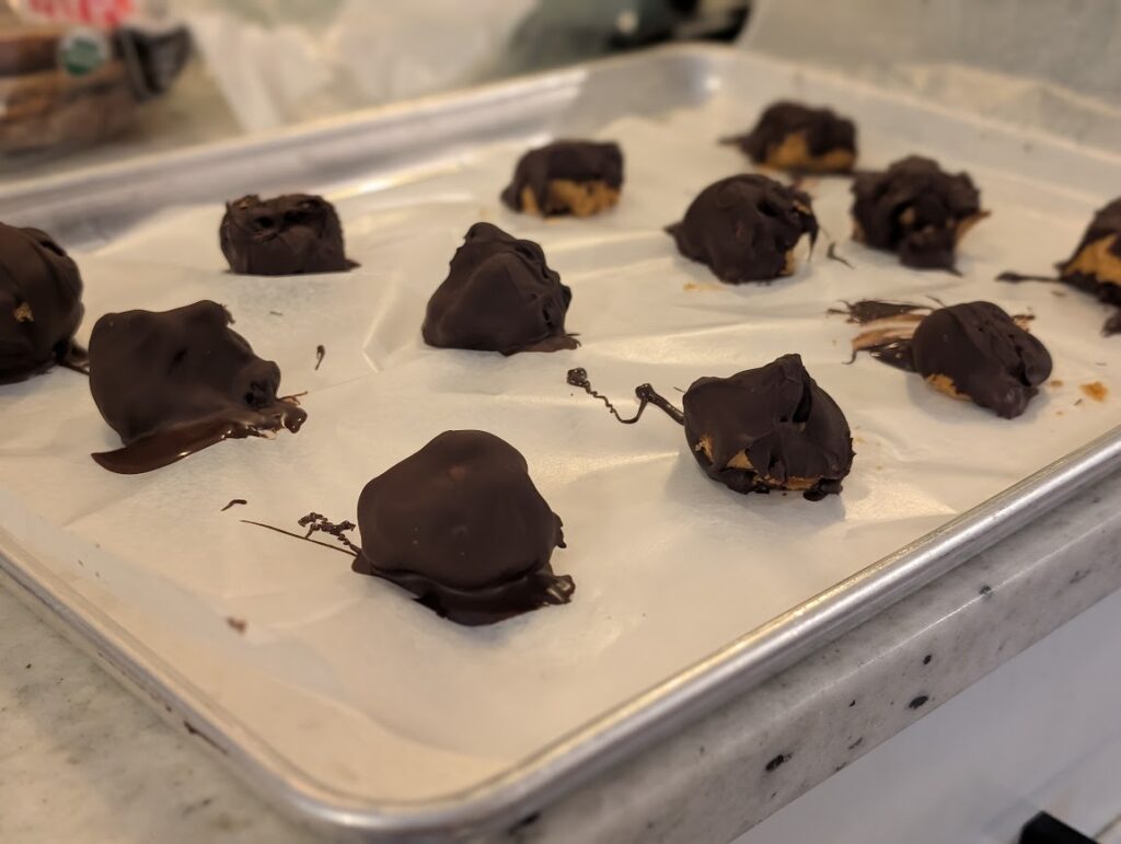 Three Ingredient peanut butter balls on wax paper