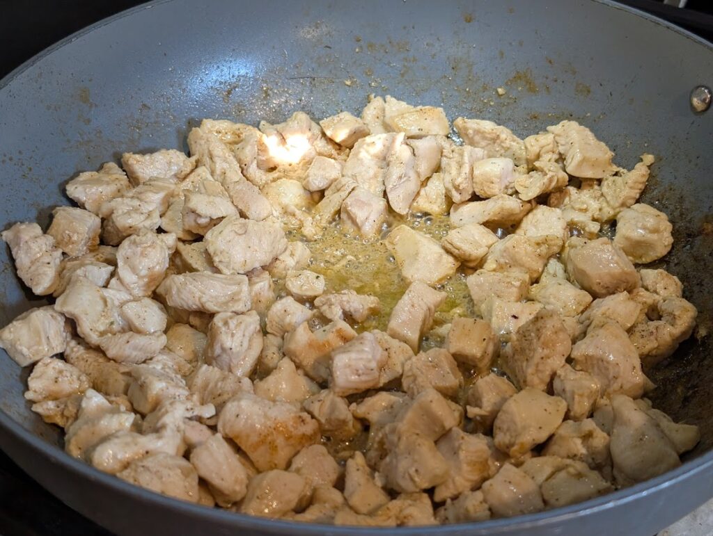 Cooking chicken for Chicken Alfredo Zucchini Pasta